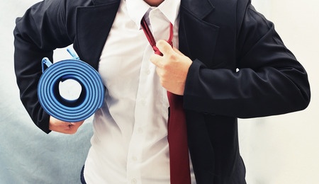 42554307 - business man holding yoga mat , exercise concept